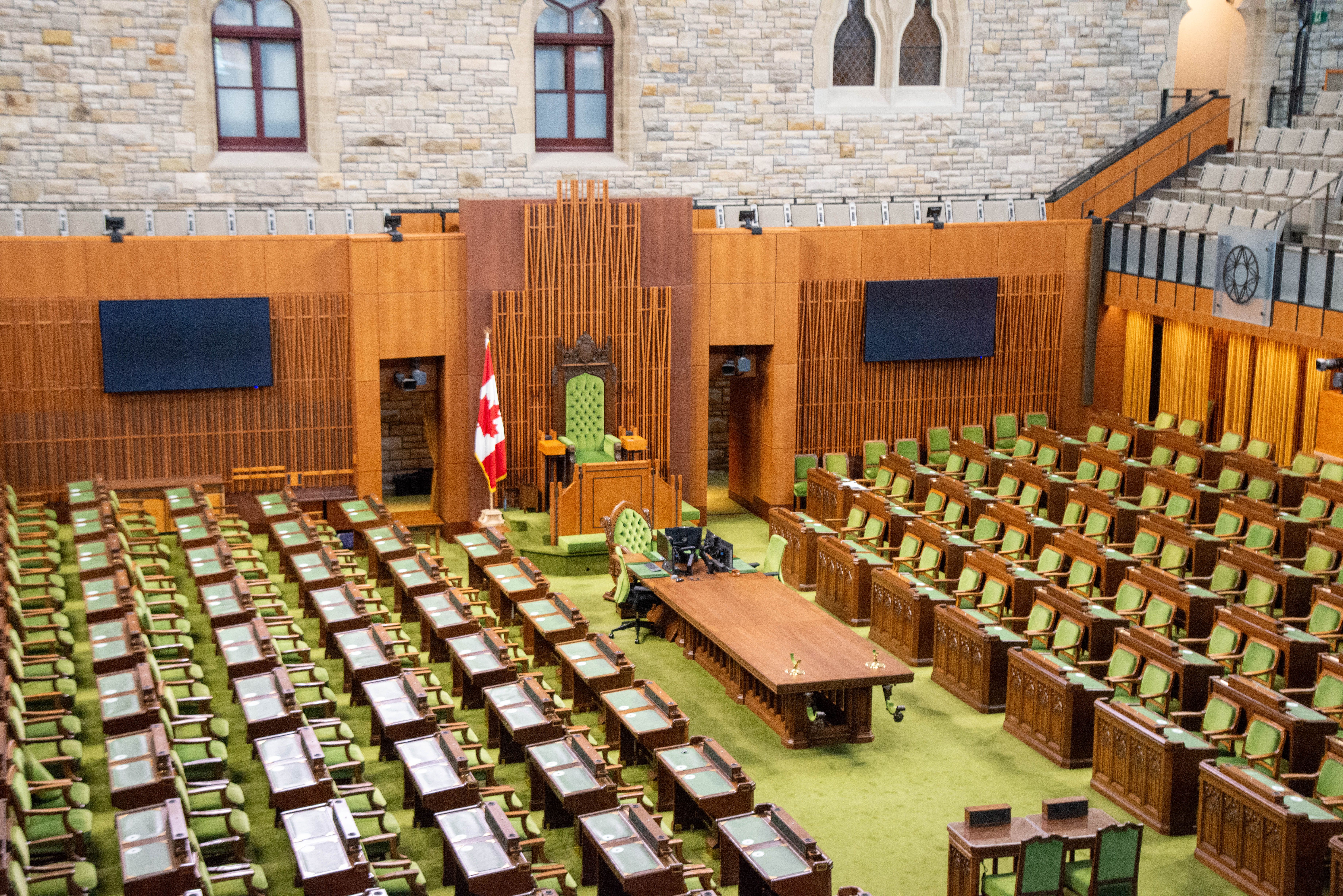 Interior of the Canadian House of Commons chamber where public officials legislate